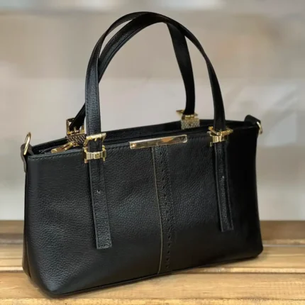 کیف زنانه چرم طبیعی مدل لیزری مشکی با یراق طلایی